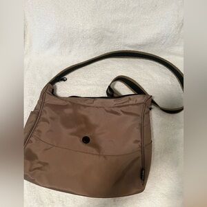 Pacsafe Brown Shoulder Bag with Adjustable Strap and Minimalist Design
